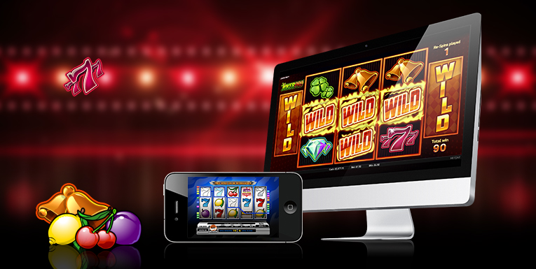 Slotssymboler, smartphone med slotsspel och datorskärm med slotsspel